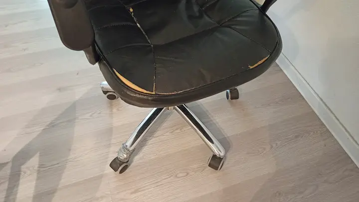 Torn swivel chair